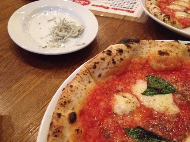 Yummy pizza watched by the fish with eyeballs on the top left :-(